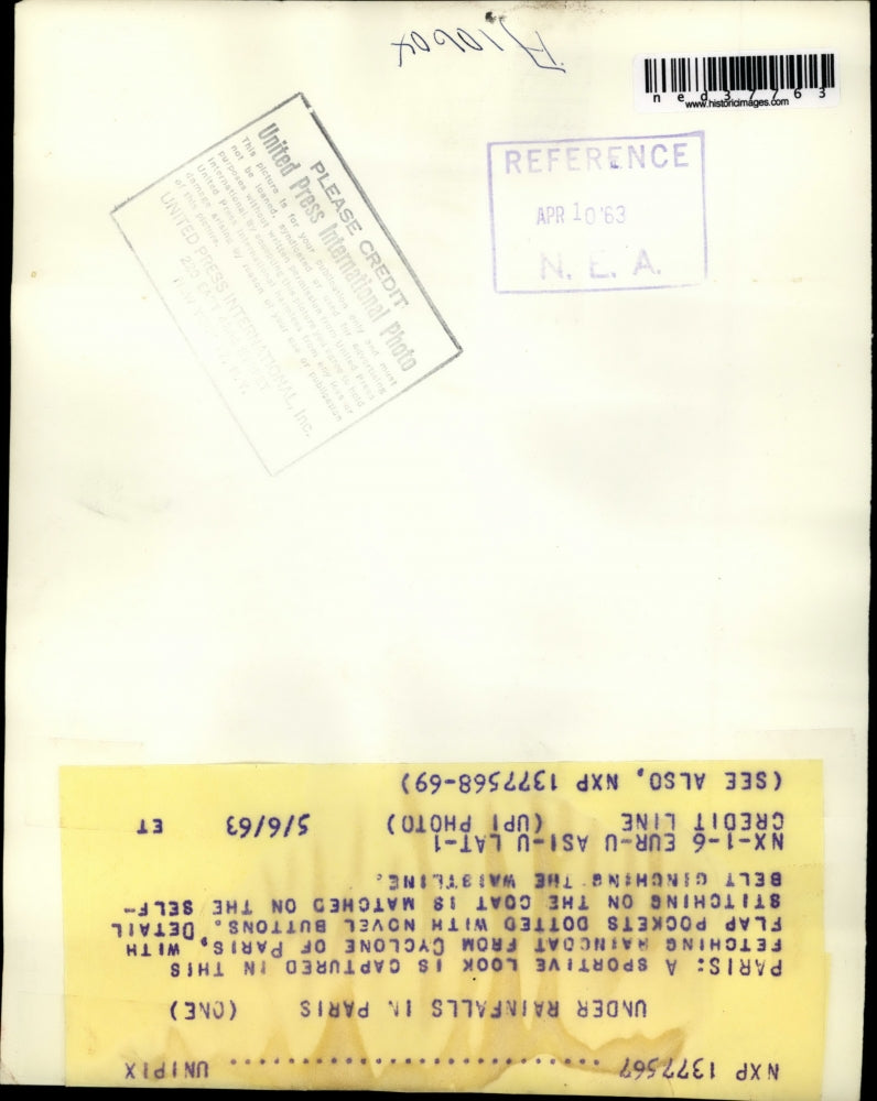 1963 Press Photo Woman Models Cyclone Raincoat in Paris - ned37763