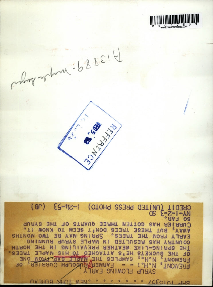 Load image into Gallery viewer, 1953 Press Photo Farmer Rudolph Currier, samples maple sap
