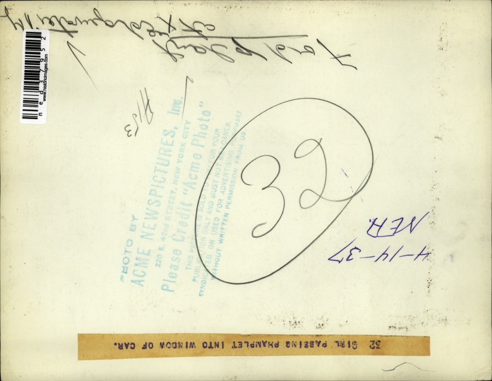 1937 Press Photo Ford Plant, girl passing phamplet into window - ned37952