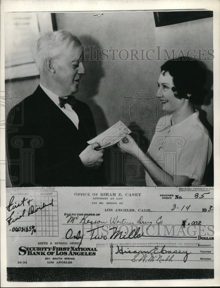 1935 Press Photo Hiram Casey handing check to Gladys Nickel for delivery