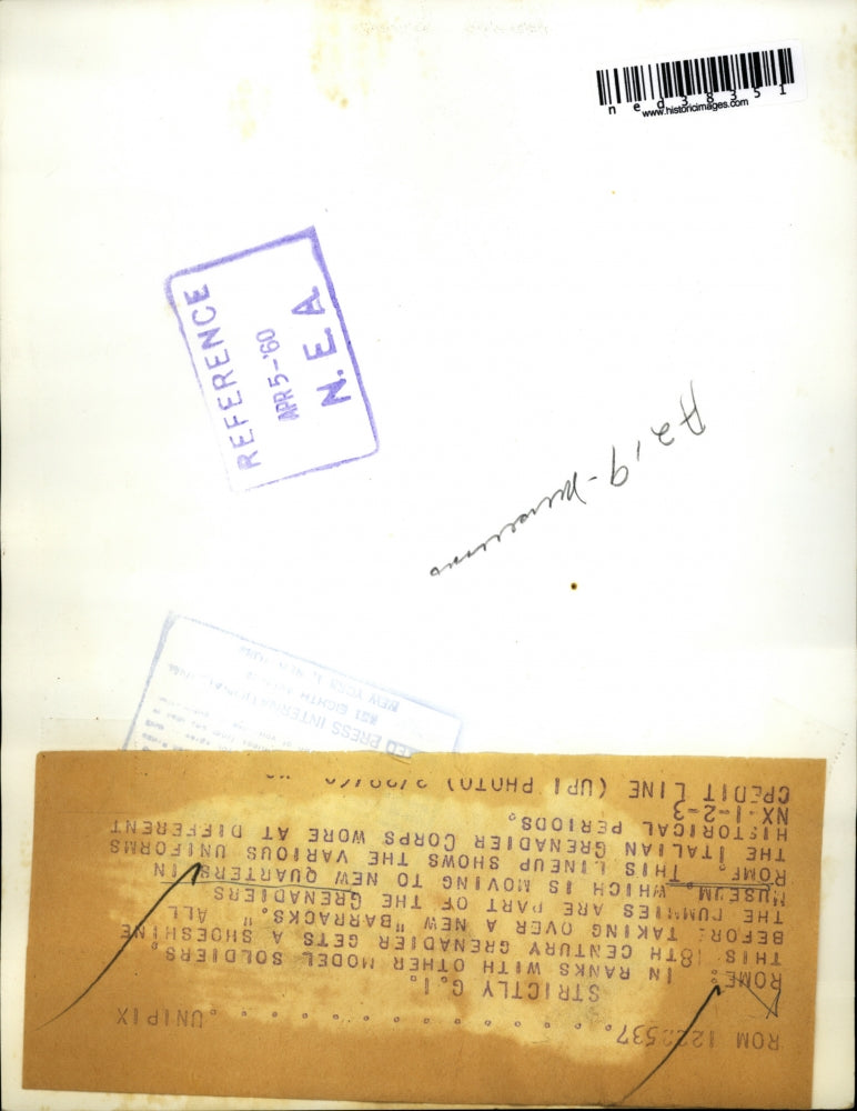 1950 Press Photo 18th century grenadier gets shoeshine