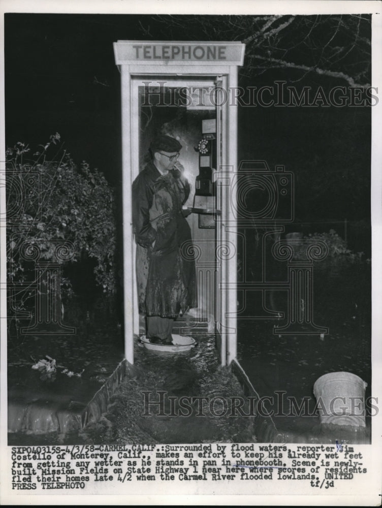1958 Press Photo Jim Costello stands in a pan in the phonebooth