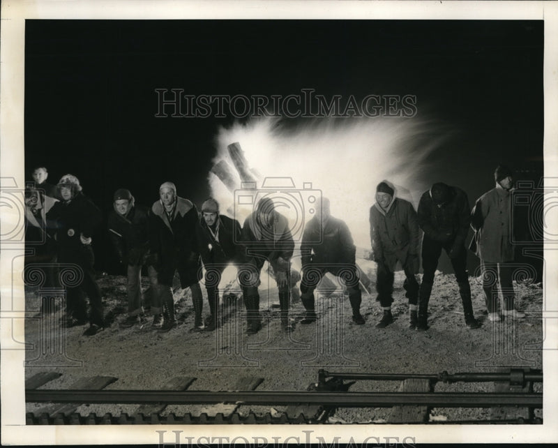 Load image into Gallery viewer, 1939 Press Photo Arriving at the summit the boys build a huge fire and thaw ot.
