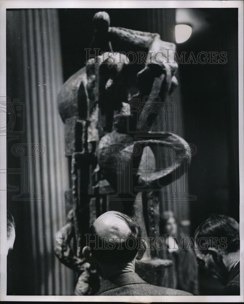 Load image into Gallery viewer, 1952 Press Photo A baldheaded man studies complex modernistic sculpture while
