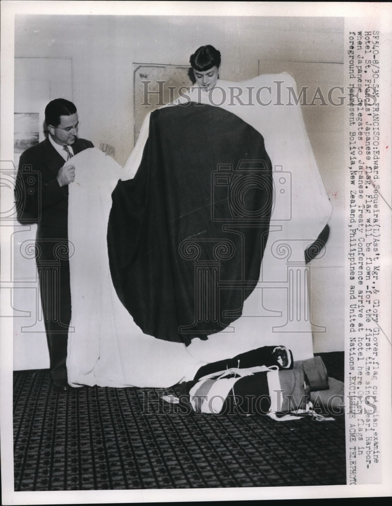Load image into Gallery viewer, 1951 Press Photo Edward Sequeira &amp; Glory Glover Examine Japanese Flag
