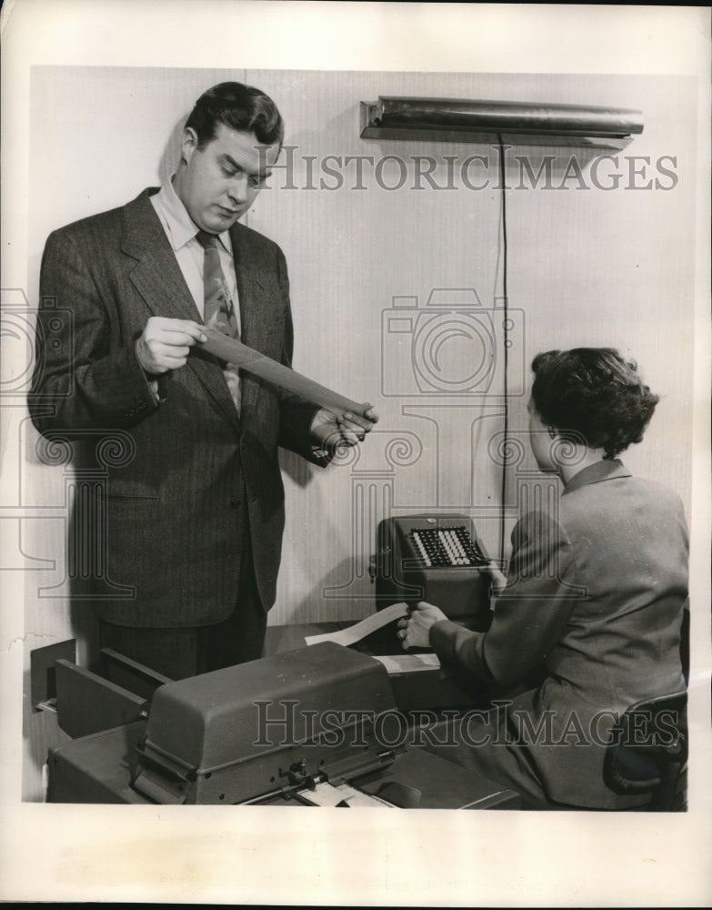 Load image into Gallery viewer, 1953 Press Photo Jack Nugent Inspects the Check Processing System
