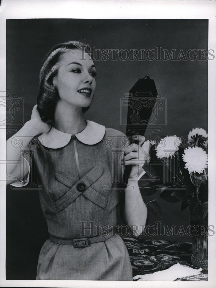 Load image into Gallery viewer, 1956 Press Photo Woman Looking At The Finished Product Of Her Tinted Hair
