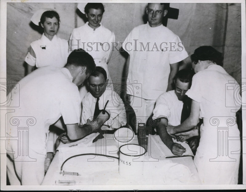 Load image into Gallery viewer, 1937 Press Photo Taking Blood from donors
