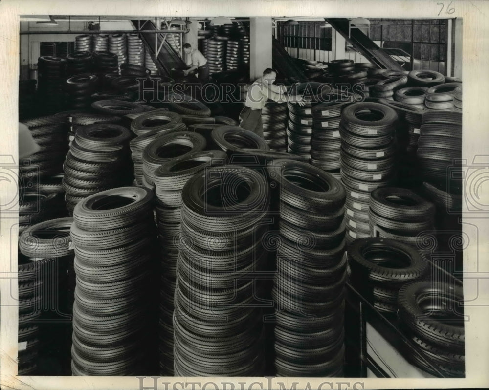 1945 Press Photo Firestone Plant Begun to Flow Off