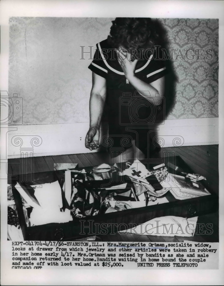 1956 Press Photo Evanston Ill Mrs Marguerite Otman socialite widow looks at