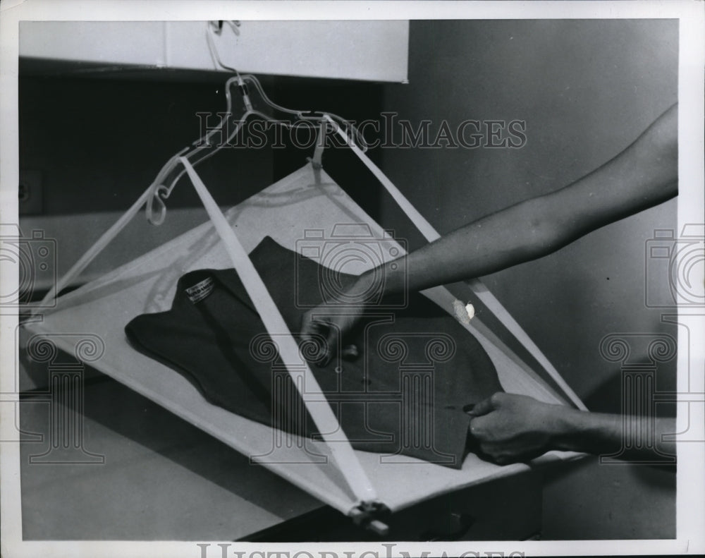 1957 Press Photo Drying a sweater