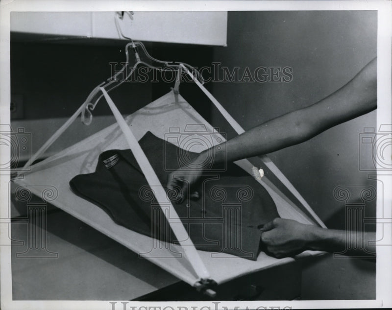 Load image into Gallery viewer, 1957 Press Photo Drying a sweater
