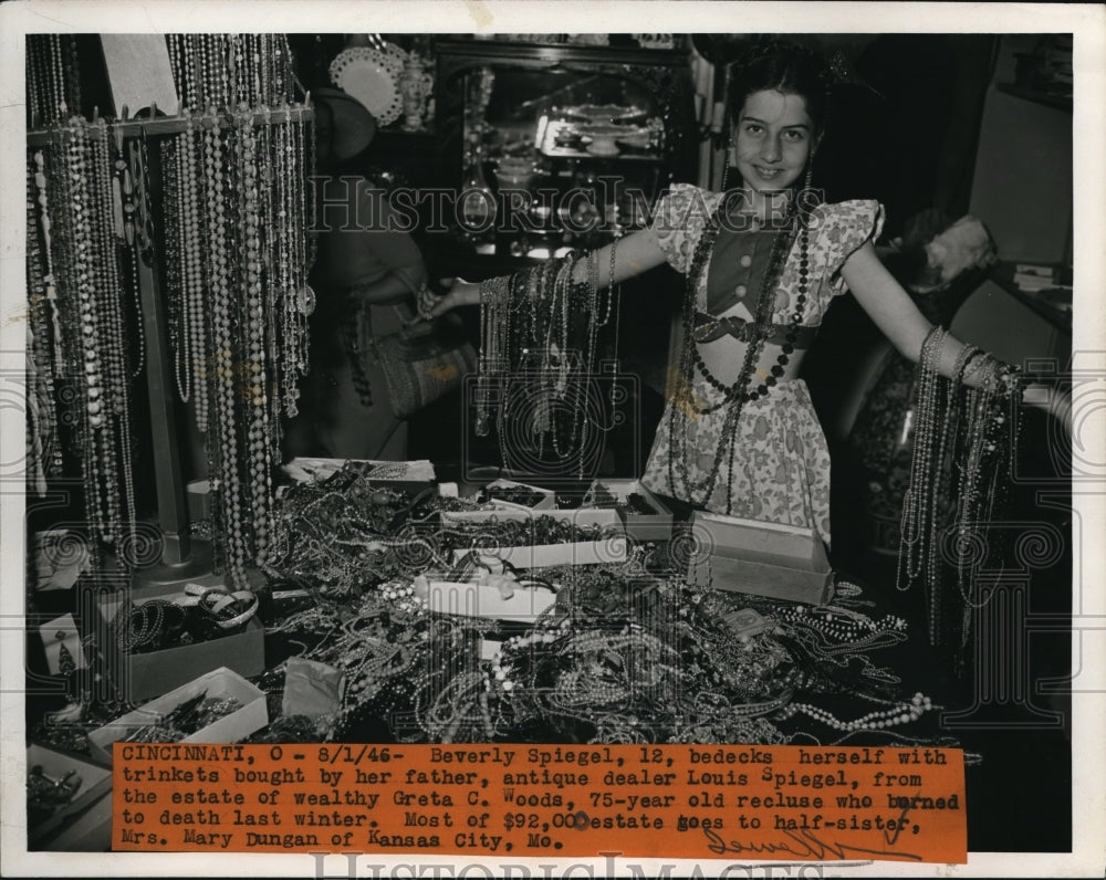 1946 Press Photo Beverly Spiegel, 12, bedecks herself with trinkets bought by