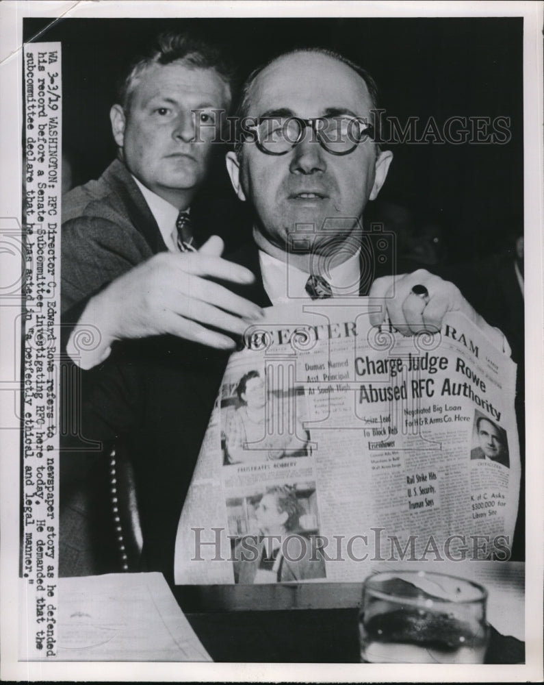 Load image into Gallery viewer, 1951 Press Photo C. Edward Rowe refers to a newspaper story to defend his record
