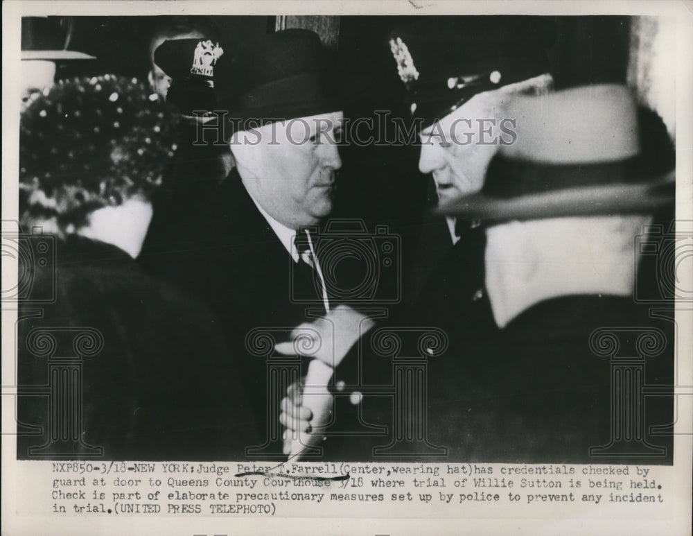1952 Press Photo Peter Farrell has credentials checked by the guard at door