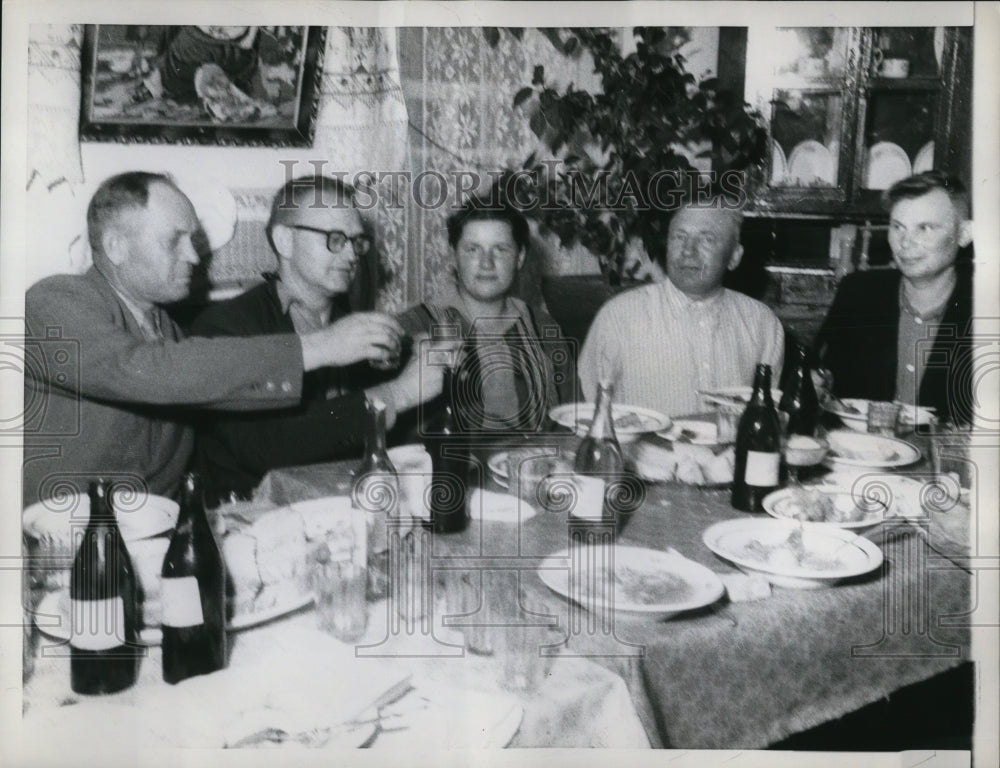 1958 Press Photo Men toasting to peace and friendship at a Russian farm home