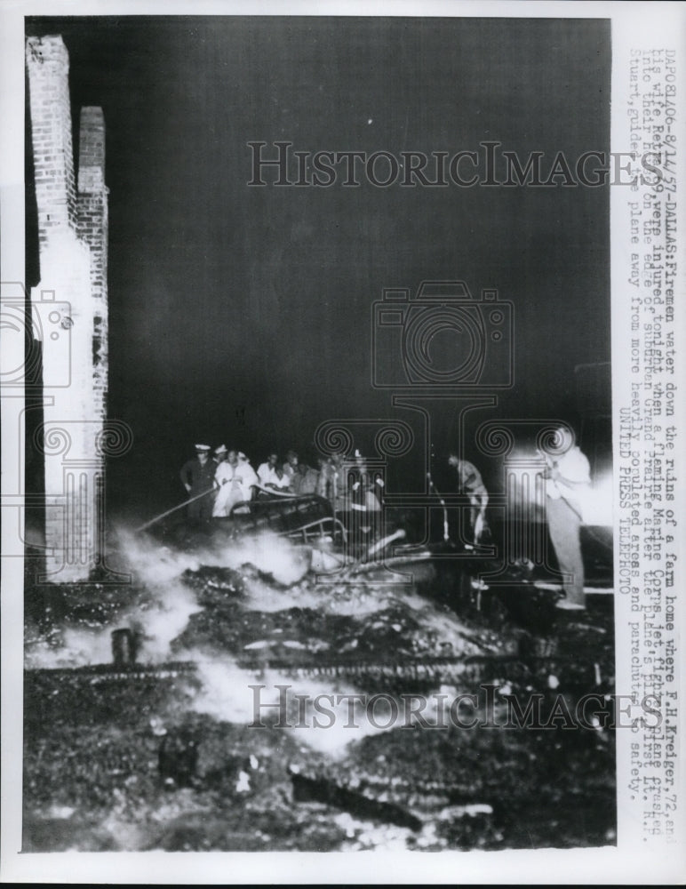 1957 Press Photo Firemen Water Down The Ruins Of A Farm Home