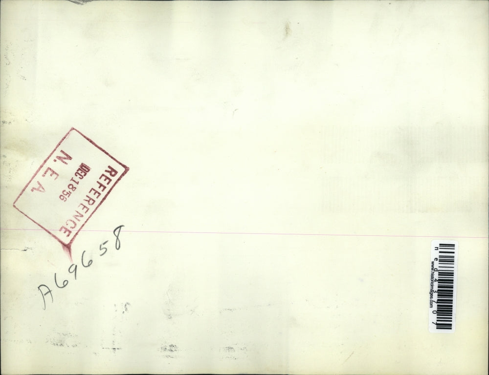 1956 Press Photo Don Smith Examines Collapsed Foreign Auto Shop