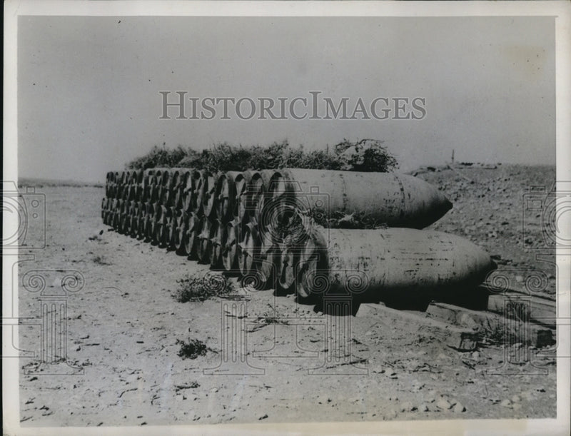 Load image into Gallery viewer, 1941 Press Photo High Explosive Bombs left behind in an unnamed airport in Lybia
