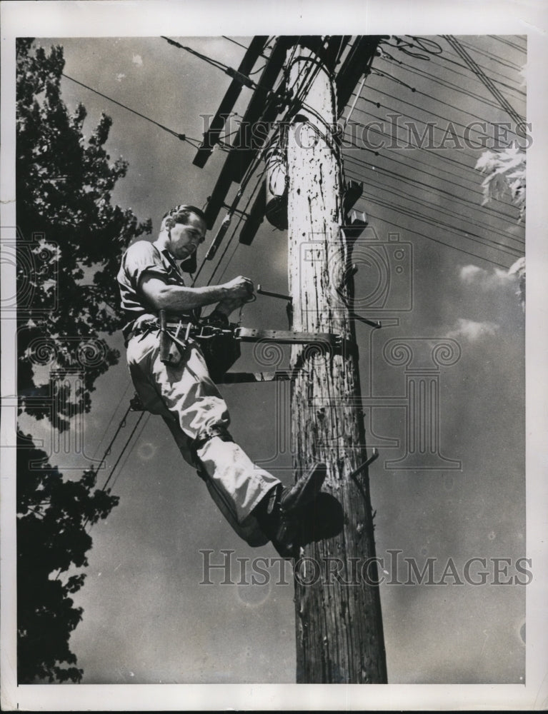 Load image into Gallery viewer, 1948 Press Photo Ralph Emerson Heile who is both President and Part Time Lineman
