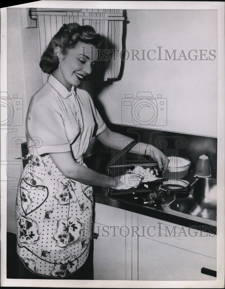 1951 Press Photo A model showing sponge bath for leather items