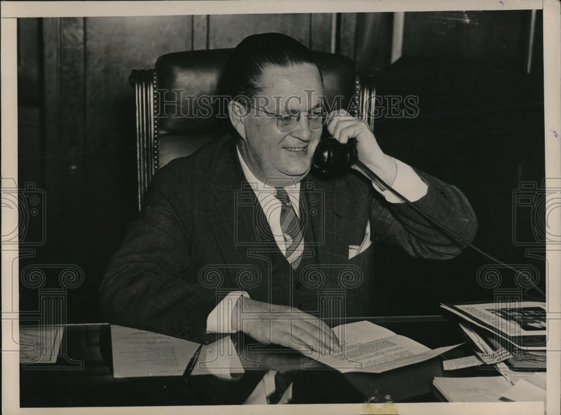 Load image into Gallery viewer, 1936 Press Photo Assistant Postmaster General W.W. Howes as he answers the phone
