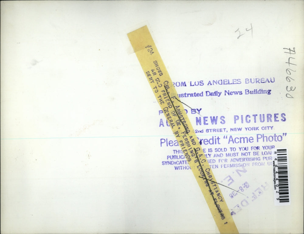 1938 Press Photo Colonel F. Armstrong and G.A.C. Christiancy looking at flowers