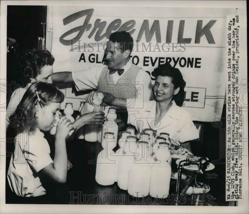 1950 Press Photo Bob Seidel Proprietor and Florence Holt Giving Out Free Milk- Historic Images