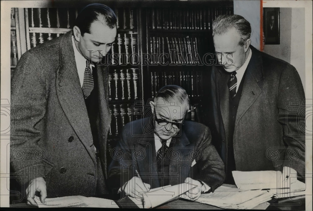 1953 Press Photo Benjamin Schreiber as he signs an order