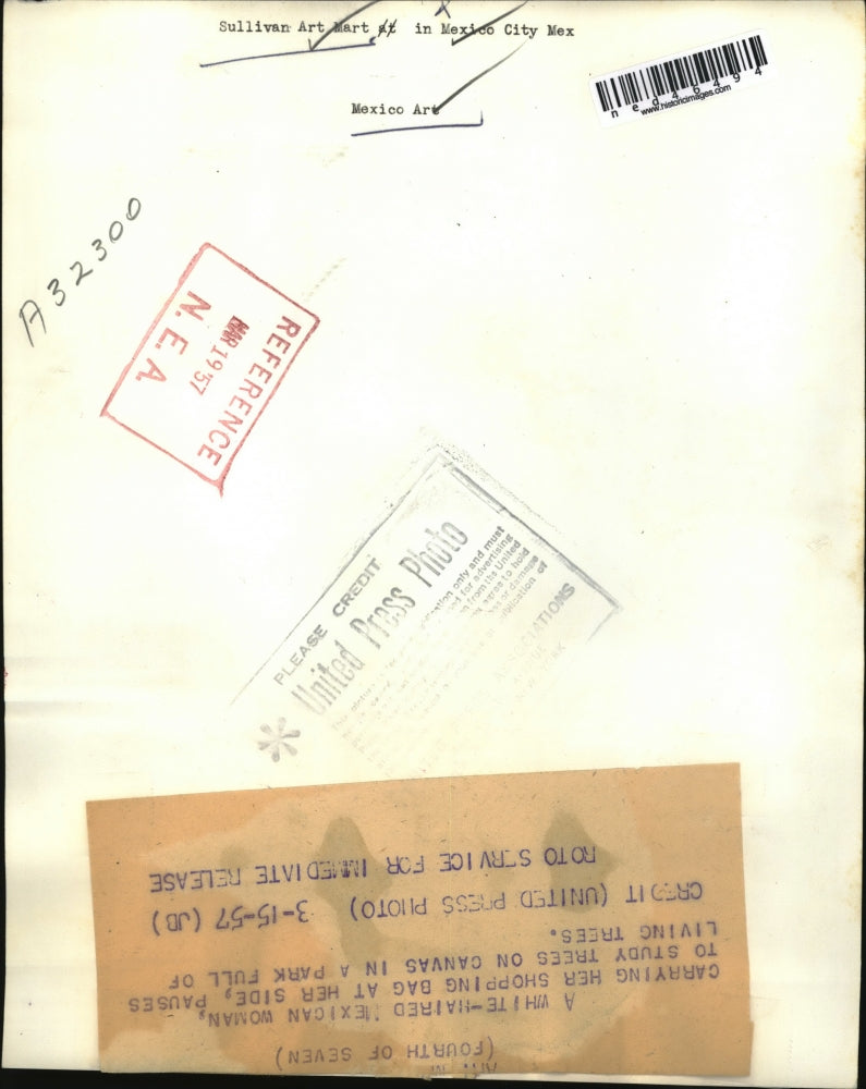 1957 Press Photo An elderly woman pauses from her shopping