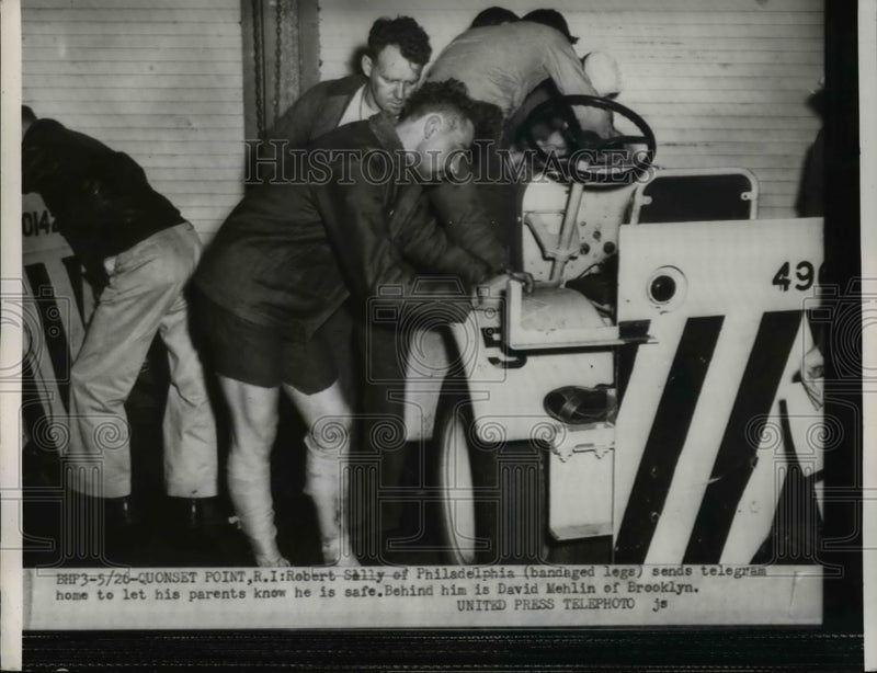 Load image into Gallery viewer, 1954 Press Photo Robert Sally of Philadelphia sending a telegram to his parents.
