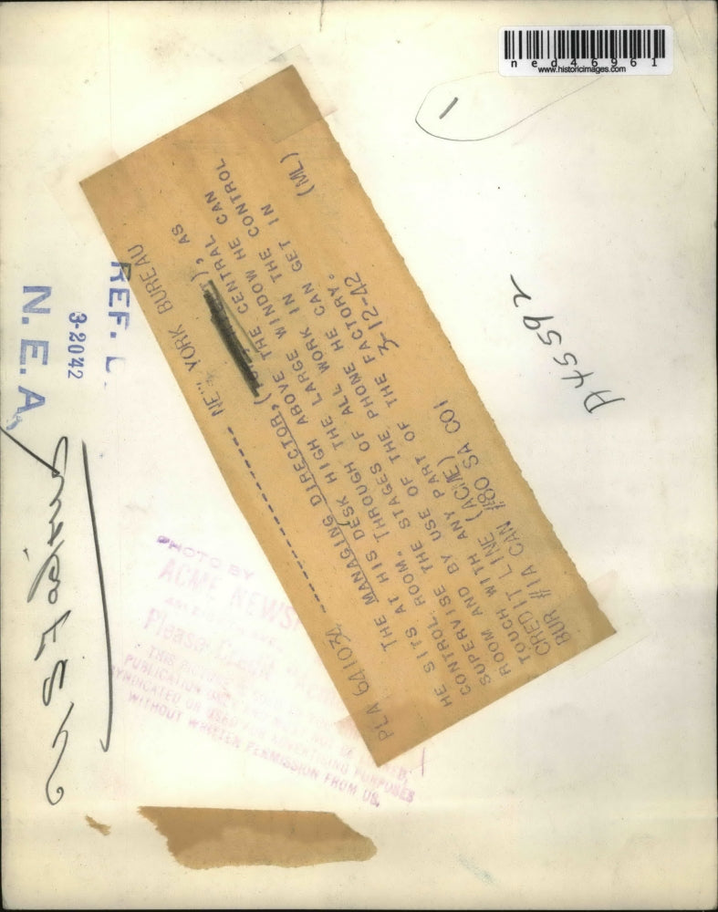 1942 Press Photo The Managing Dir. sits at his desk above the Central Control Rm