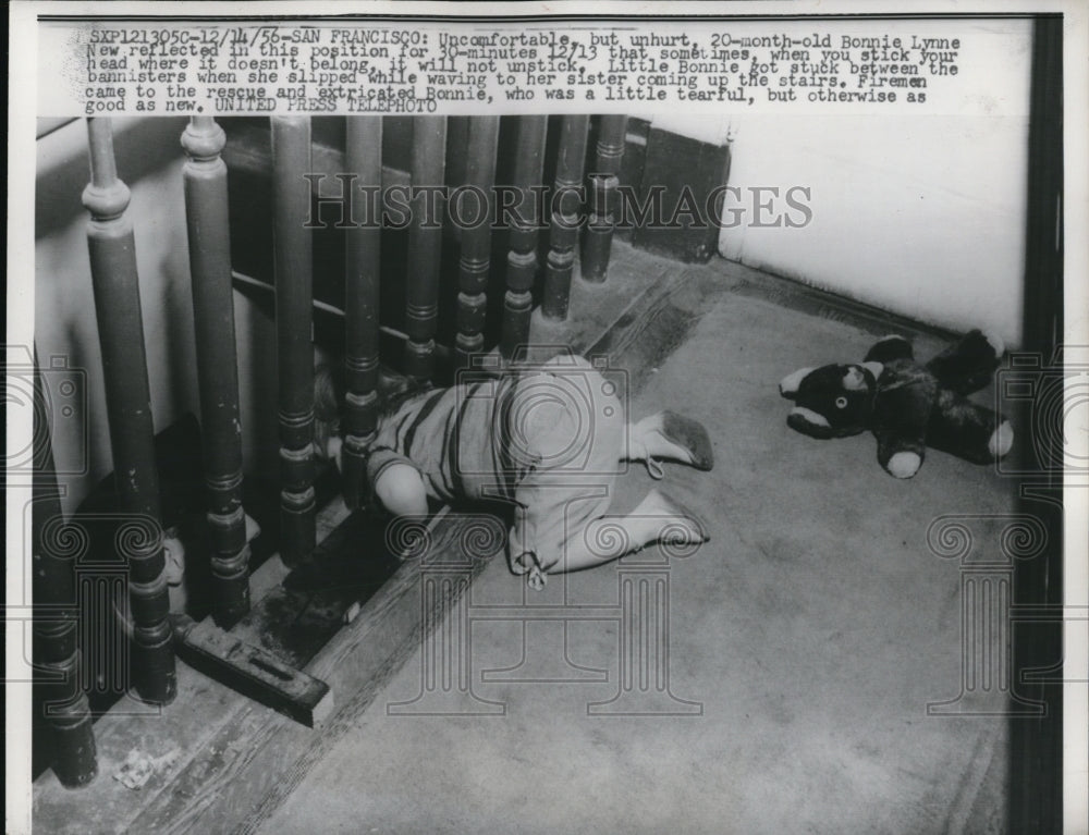 1956 Press Photo Bonnie Lynne stuck between the bannisters when she slipped