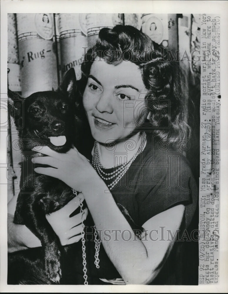 Load image into Gallery viewer, 1952 Press Photo Miss Freda Furman, radio scriptwriter with her dog, Mandy
