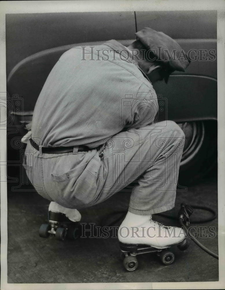 Load image into Gallery viewer, 1957 Press Photo Gas Station Attendant on Roller Skates - ned49538
