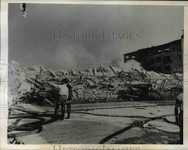 Load image into Gallery viewer, 1943 Press Photo Kearny NY Rubble and glass are all that's left of the Congoleum
