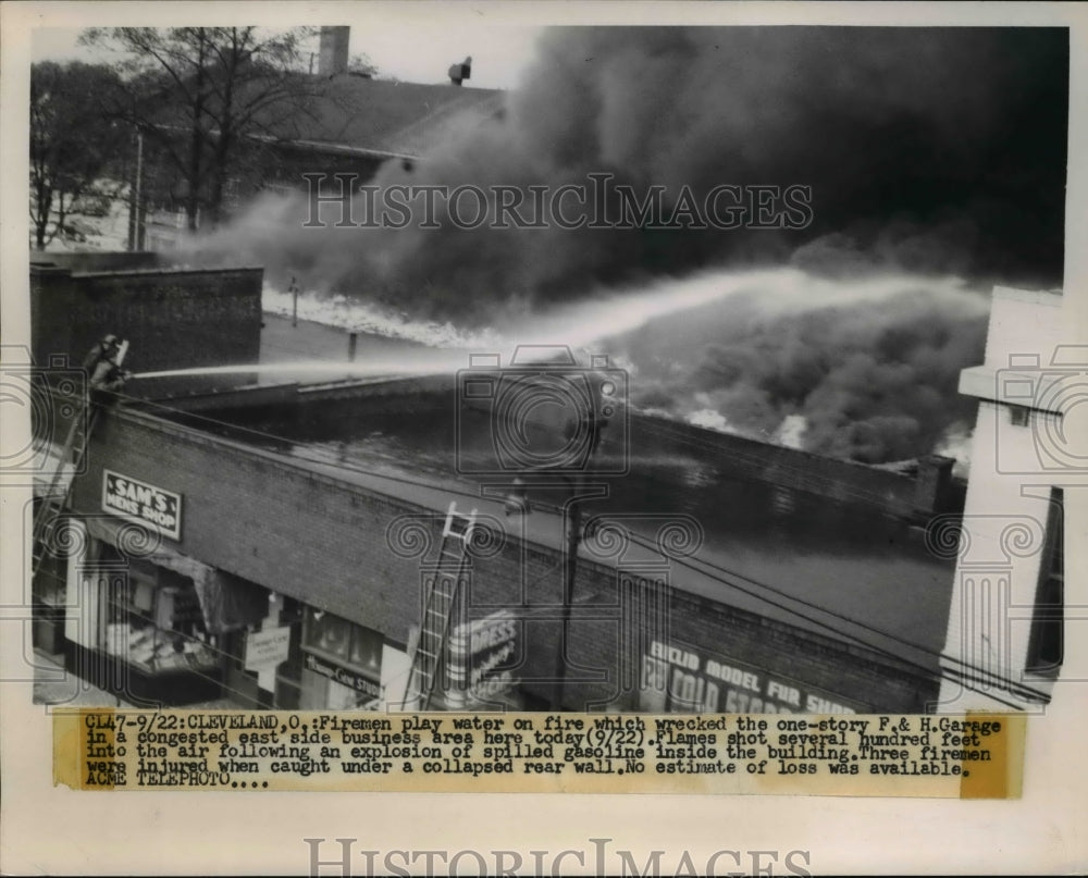 1951 Press Photo Cleveland firemen play water on fire which wrecked the F & H
