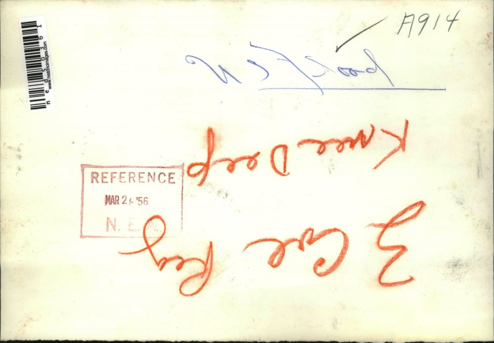 1956 Press Photo Man carries child thru floodwaters in home town USA