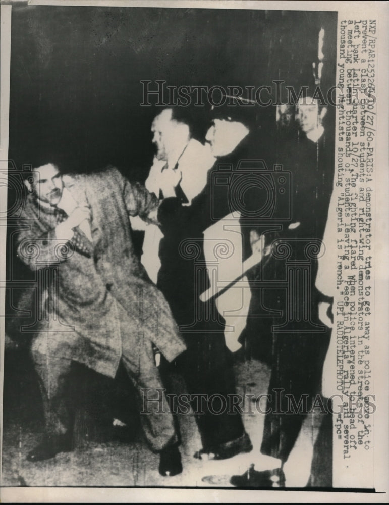 1960 Press Photo Demonstrator Tries to Get Away From Police in Paris