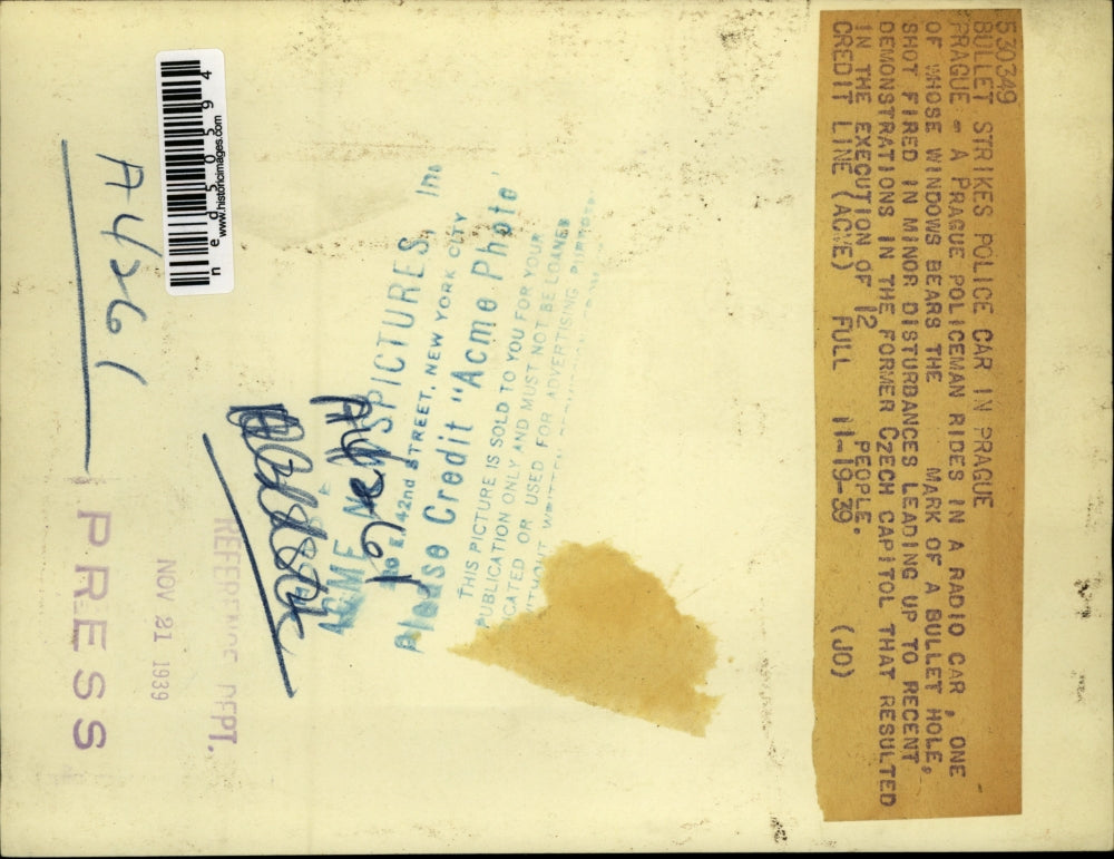 1939 Press Photo Policemen Rides in Radio Car w Bullet Hole in Window, Prague