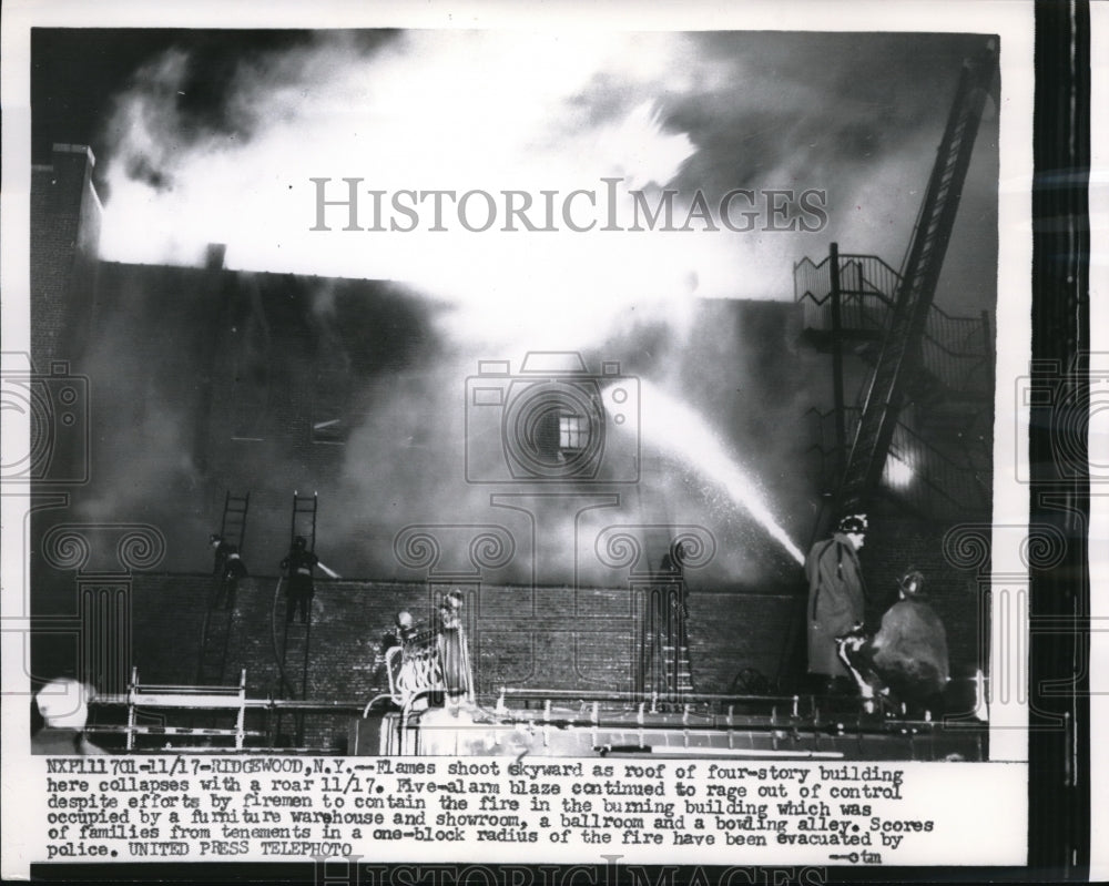 1956 Press Photo Ridgewood NY flames on 4 story building as it collapses