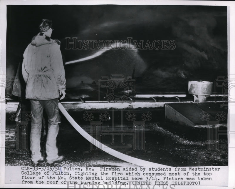 Load image into Gallery viewer, 1956 Press Photo Fireman aided by student fighting fire MO State Mental Hospital
