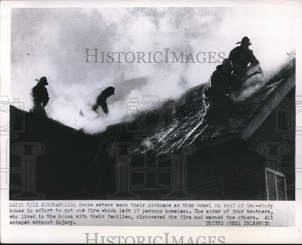 1952 Press Photo Minneapolis firemen on roof of two story house - ned51173