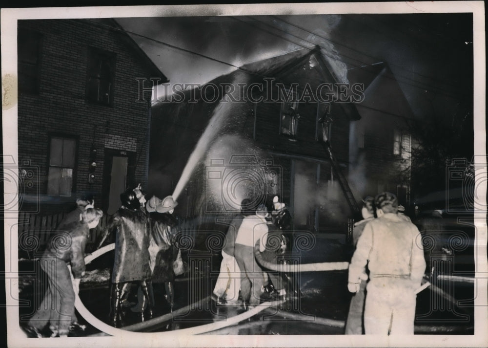 1952 Press Photo Cleveland Ohio firemen battle blaze at frame house