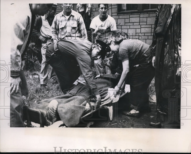 Load image into Gallery viewer, 1951 Press Photo Wall of burning building falls on fireman in Cleveland
