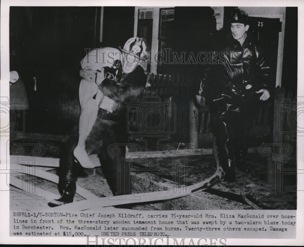 1953 Press Photo Joseph Kildruff carrying Mrs. Eliza MacDonald over hose lines