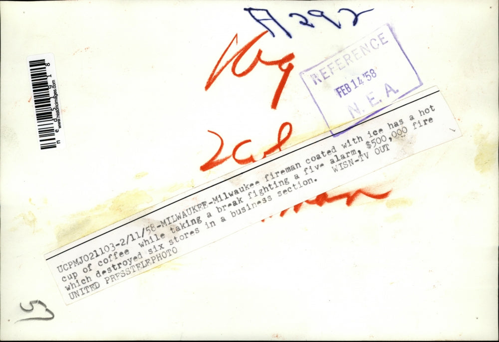 1958 Press Photo Milwaukee fireman's hat coated with ice