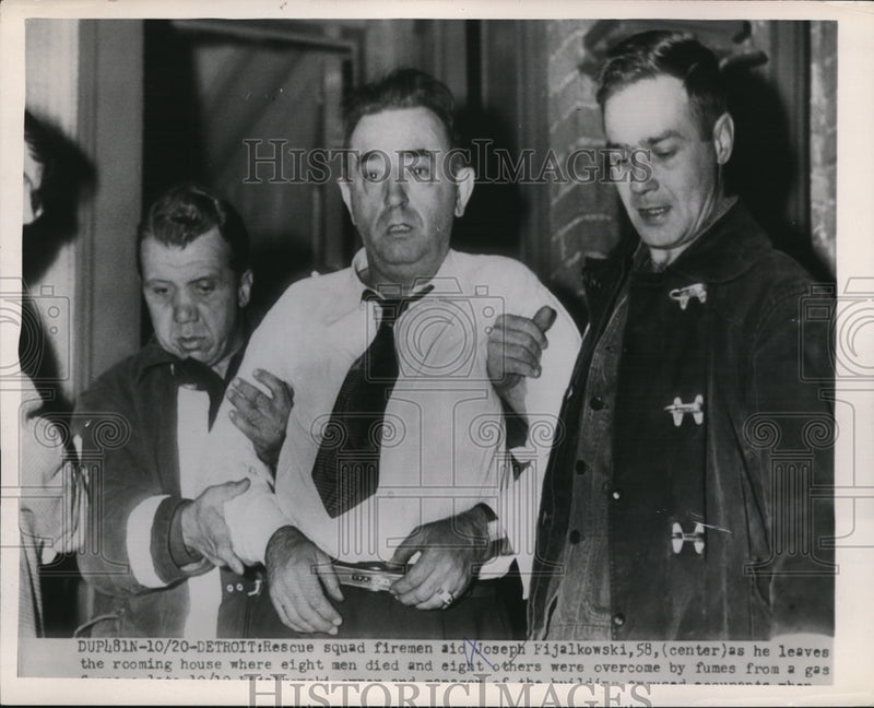 Load image into Gallery viewer, 1954 Press Photo Joseph Fijalkowski (C), 58, rescued by squad of firemen aid
