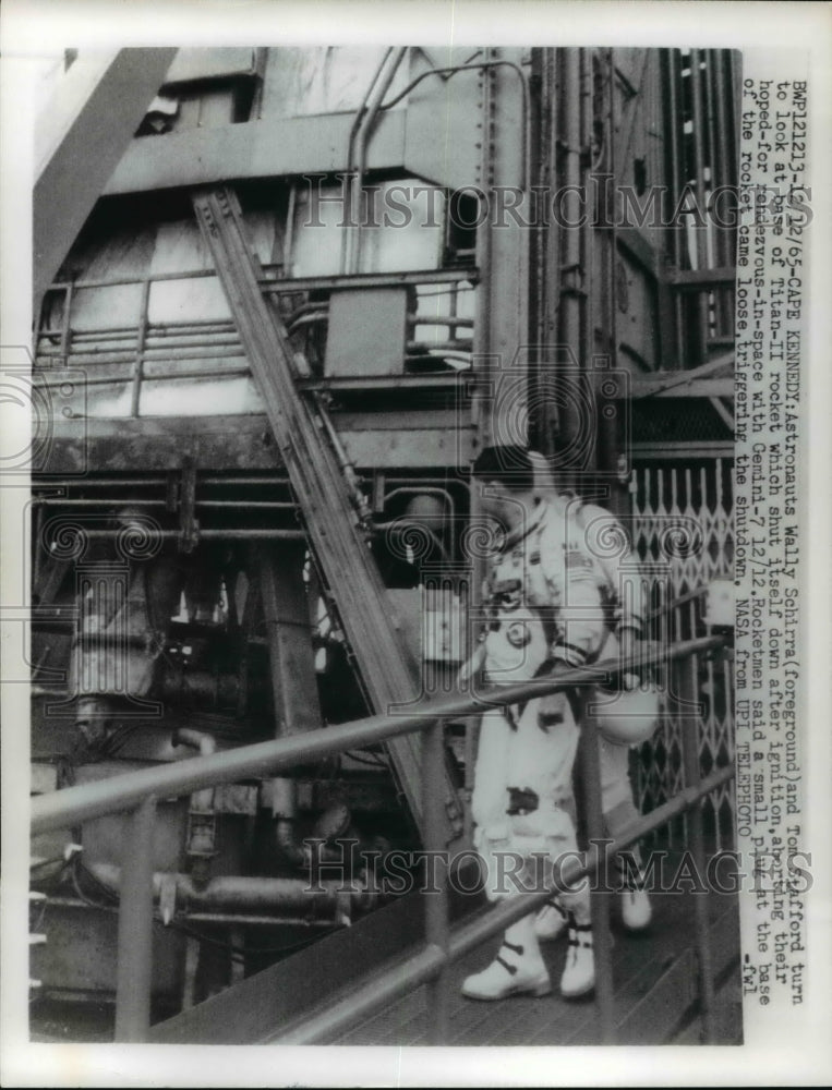 1965 Press Photo Astronaut Wally Schirra & Tom Stafford look at base of Titan II