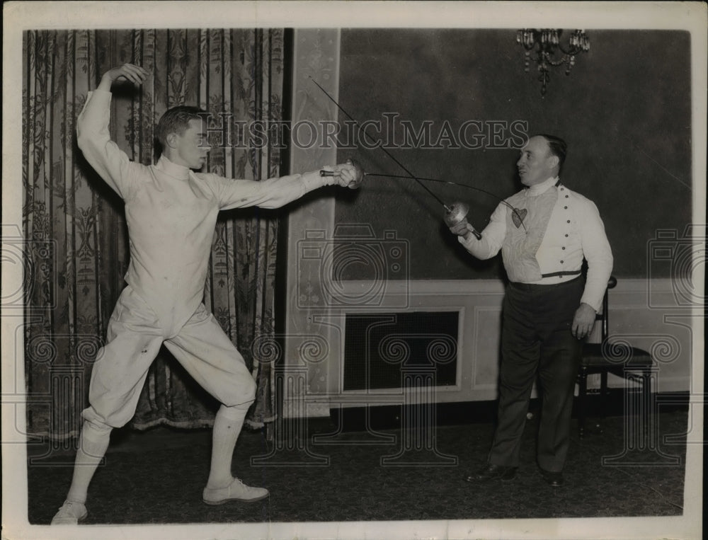 1937 Press Photo Maurice Grasson (left), scores a touch of his father